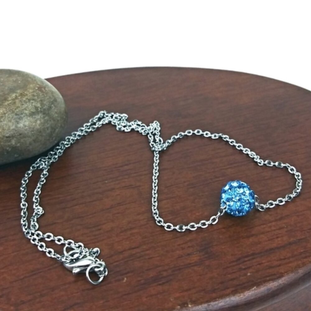 Blue rhinestone ball and silver tone chain necklace. New with tags.